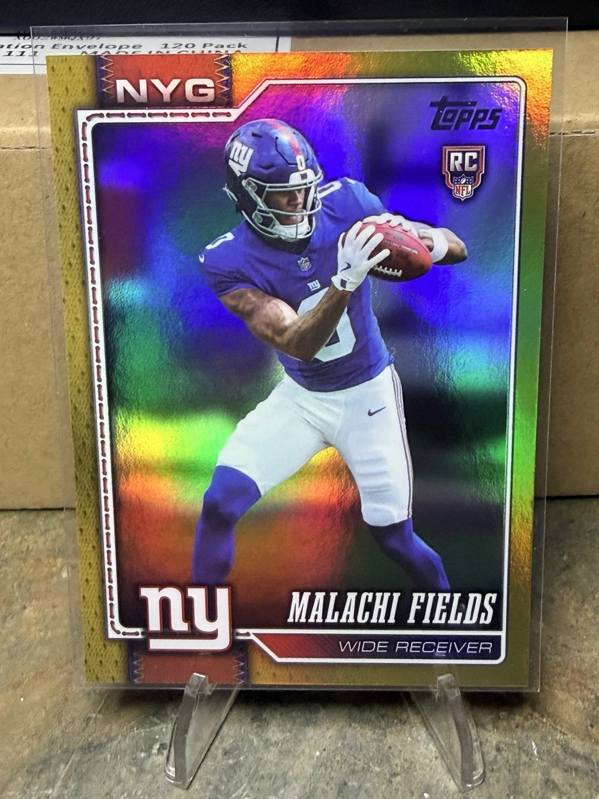 Independent seller photo of Malachi Fields 2026 Topps rookie #330 Gold, with reverse photo confirming 18/50. Reference printing differs from the requested Orange 08/25 card.
